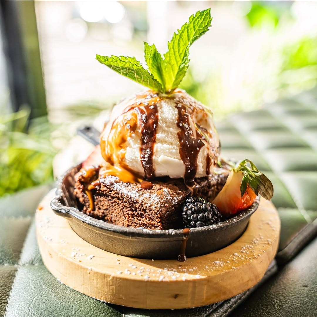 Brownie sundae with vanilla ice cream and berries