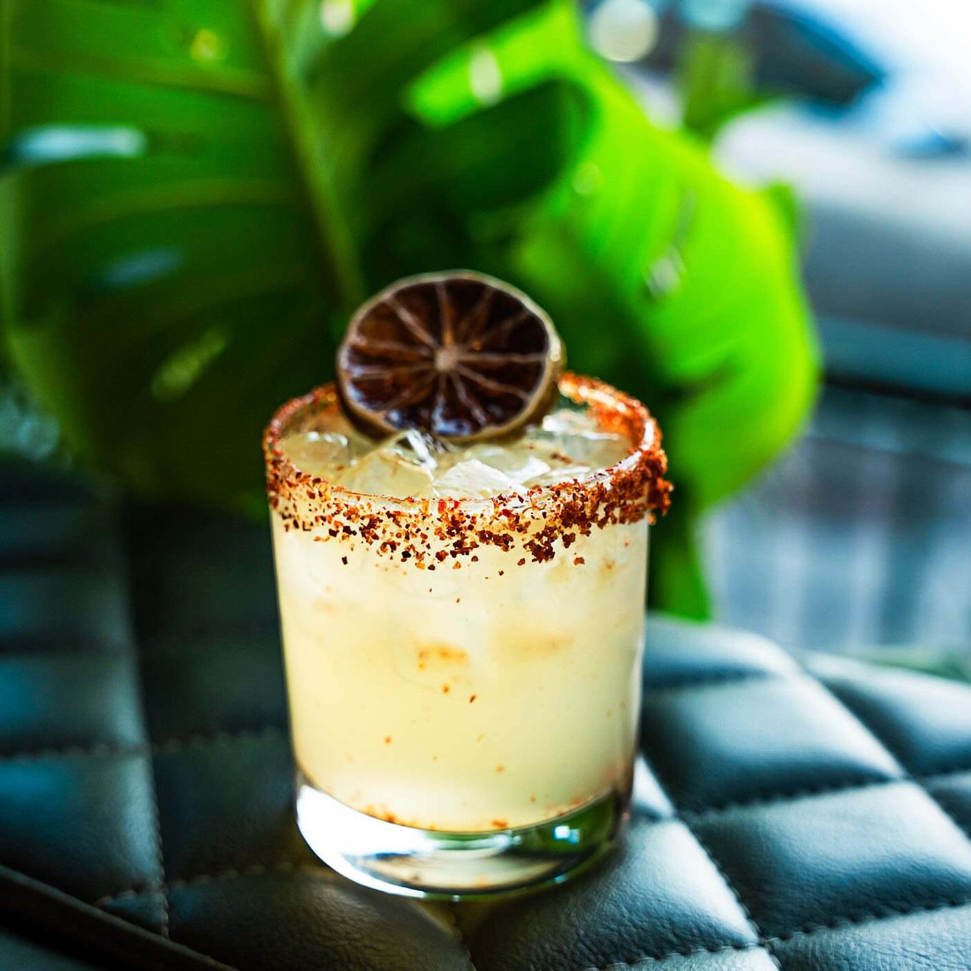 Citrus cocktail with a chili-rimmed glass