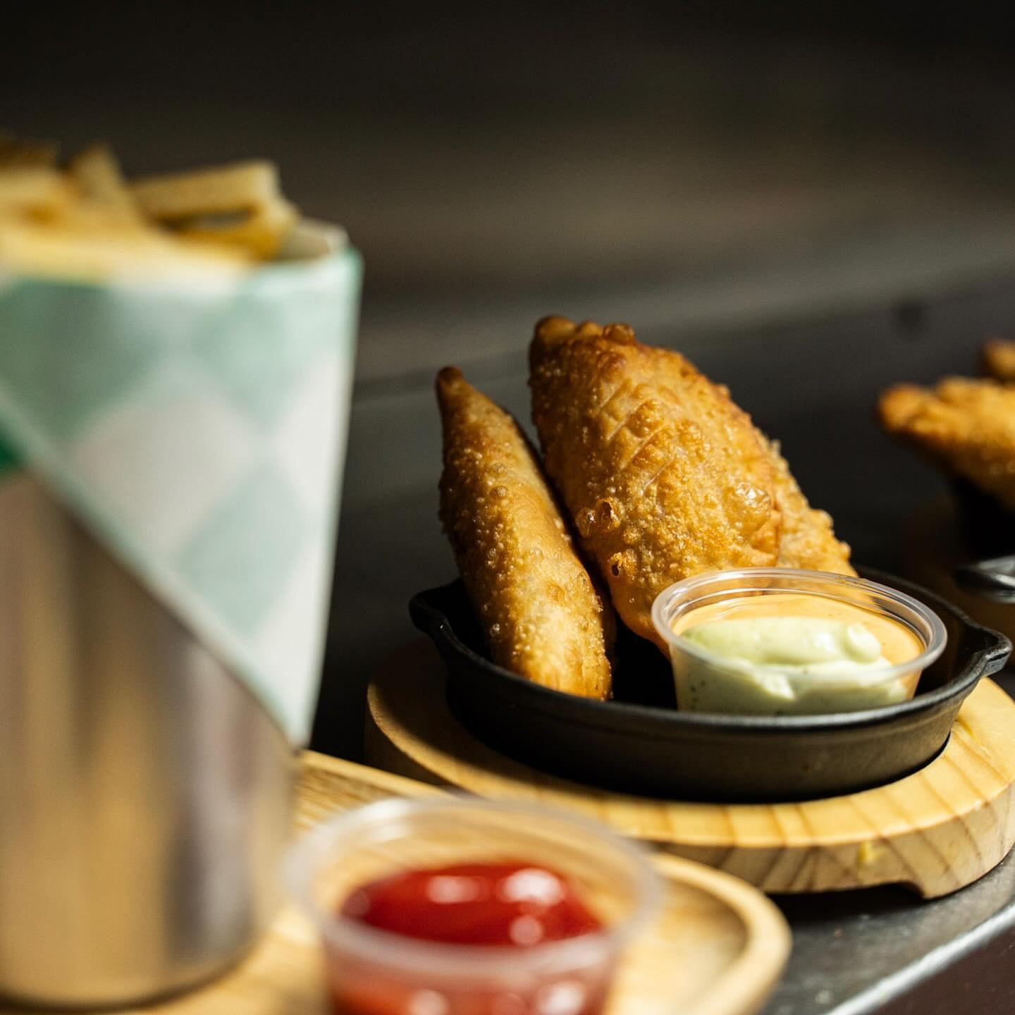 Golden empanadas with dipping sauces