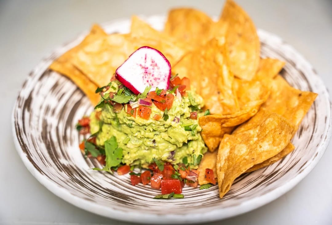 Fresh guacamole served with crisp tortilla chips